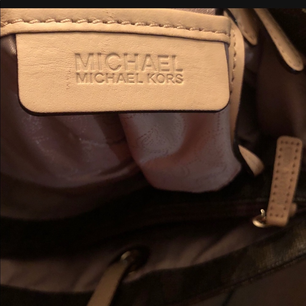 Large leather Mk purse packets inside and outside